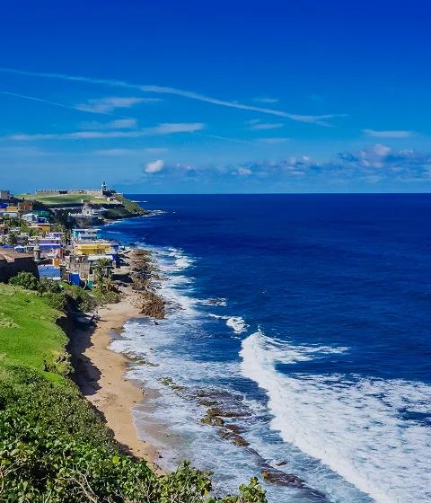 Stunning aerial view of San Juan's historic coastline with colonial architecture and pristine beaches