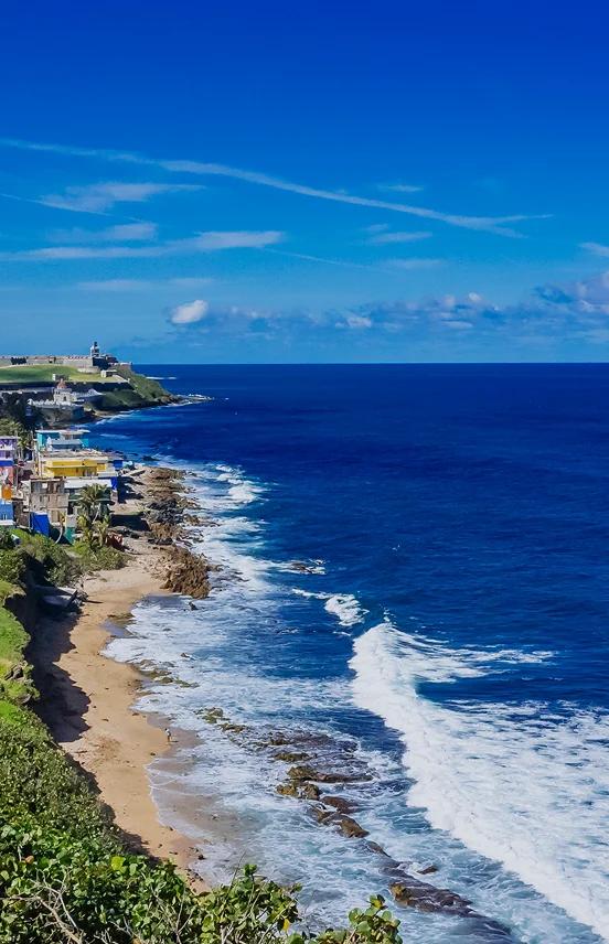 Stunning aerial view of San Juan's historic coastline with colonial architecture and pristine beaches
